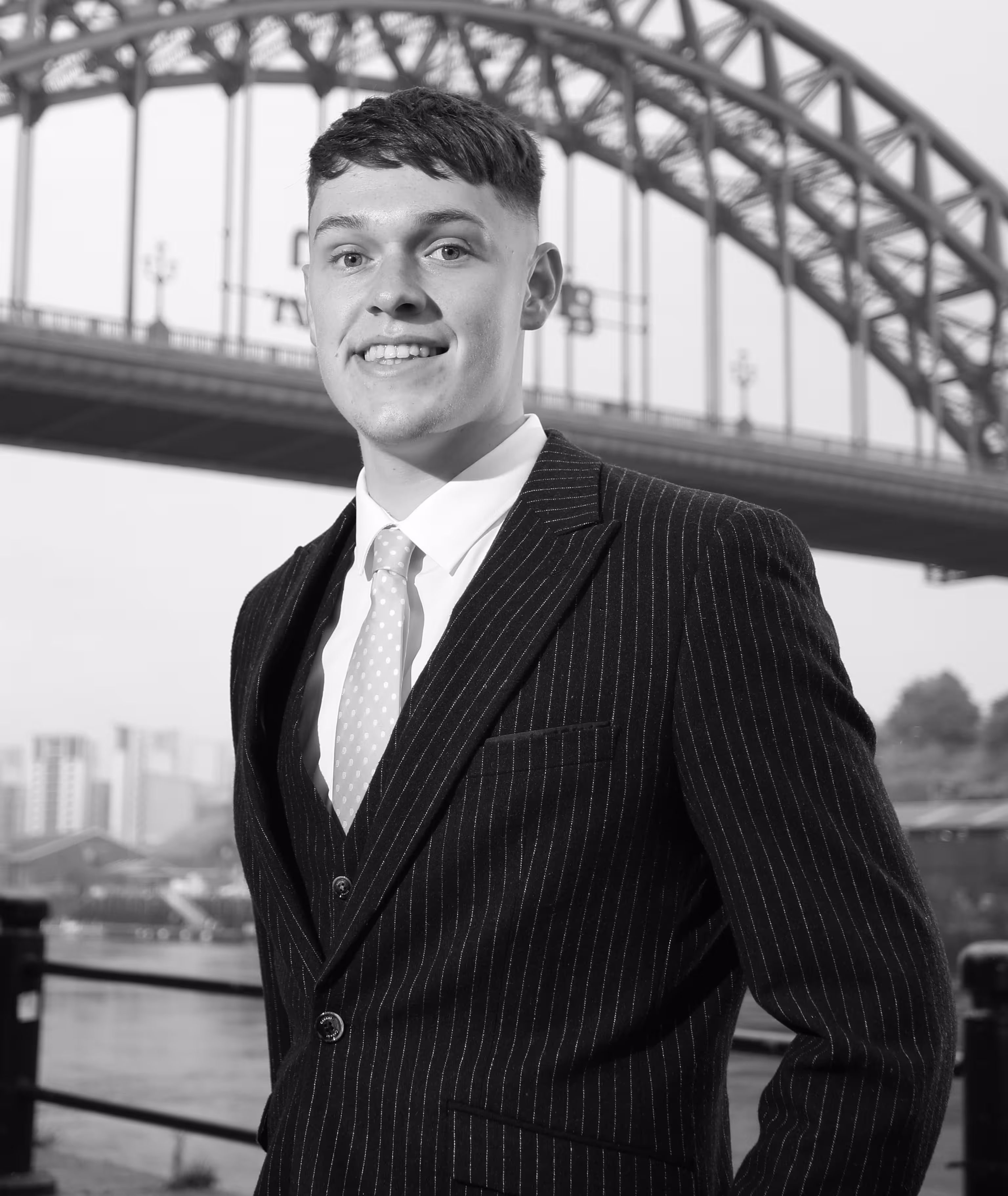 Photograph of Louis Gleeson standing in front of Tyne Bridge
